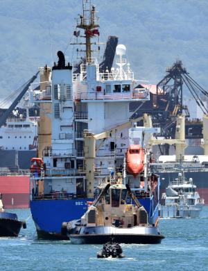 A police boat escorts a ship transporting reprocessed&nbsp;&hellip;