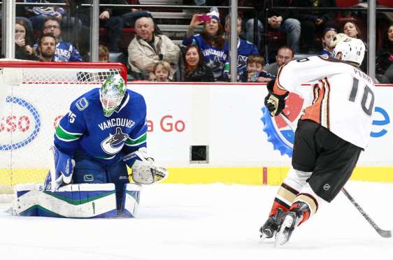 VANCOUVER, BC - JANUARY 1: Jacob Markstrom #25 of the Vancouver Canucks stops Corey Perry #10 of the Anaheim Ducks to preserve a shootout victory for the Canucks during their NHL game at Rogers Arena January 1, 2016 in Vancouver, British Columbia, Canada. Vancouver won 2-1. (Photo by Jeff Vinnick/NHLI via Getty Images)