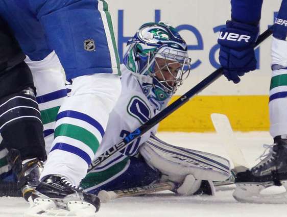 NEW YORK, NY - JANUARY 17: Ryan Miller #30 of the Vancouver Canucks makes the first period save against the New York Islanders at the Barclays Center on January 17, 2016 in the Brooklyn borough of New York City. (Photo by Bruce Bennett/Getty Images)