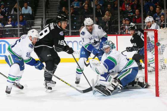 NEW YORK, NY - JANUARY 17: Ryan Miller #30 of the Vancouver Canucks makes a save on Ryan Strome #18 of the New York Islanders during the game at the Barclays Center on January 17, 2016 in Brooklyn borough of New York City. (Photo by Mike Stobe/NHLI via Getty Images)