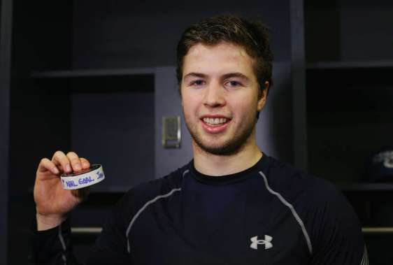 NEW YORK, NY - JANUARY 17: Ben Hutton #27 of the Vancouver Canucks holds his first NHL goal puck following a 2-1 victory over the New York Islanders at the Barclays Center on January 17, 2016 in the Brooklyn borough of New York City. (Photo by Bruce Bennett/Getty Images)