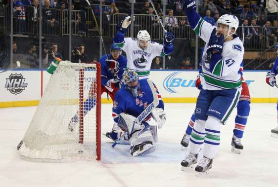 NEW YORK, NY - JANUARY 19: Sven Baertschi #47 of the Vancouver Canucks (r) celebrates his goal at 9:02 of the first period against the New York Rangers at Madison Square Garden on January 19, 2016 in New York City. (Photo by Bruce Bennett/Getty Images)