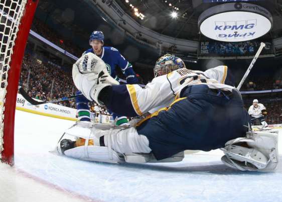 VANCOUVER, BC - JANUARY 26: Brandon Sutter #21 of the Vancouver Canucks scores on Pekka Rinne #35 of the Nashville Predators during their NHL game at Rogers Arena January 26, 2016 in Vancouver, British Columbia, Canada. (Photo by Jeff Vinnick/NHLI via Getty Images)