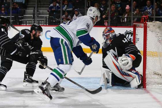 NEW YORK, NY - JANUARY 17: Jaroslav Halak #41 of the New York Islanders makes a save on Bo Horvat #53 of the Vancouver Canucks during the game at the Barclays Center on January 17, 2016 in Brooklyn borough of New York City. (Photo by Mike Stobe/NHLI via Getty Images)
