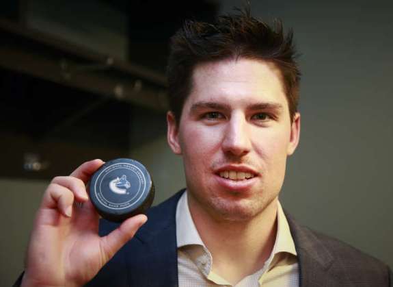 VANCOUVER, BC - MARCH 29: Logan Couture #39 of the San Jose Sharks holds the puck representing his first NHL hat trick scored during their NHL game against the Vancouver Canucks at Rogers Arena March 29, 2016 in Vancouver, British Columbia, Canada. San Jose won 4-1. (Photo by Jeff Vinnick/NHLI via Getty Images)