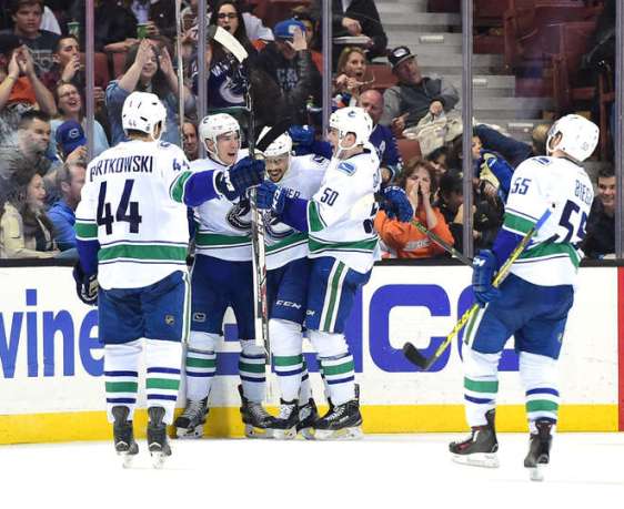 ANAHEIM, CA - APRIL 01: Emerson Etem #26 of the Vancouver Canucks celebrates his goal with Bo Horvat #53 and Brendan Gaunce #50 to take a 3-2 lead over the Anaheim Ducks during the third period at Honda Center on April 1, 2016 in Anaheim, California. (Photo by Harry How/Getty Images)
