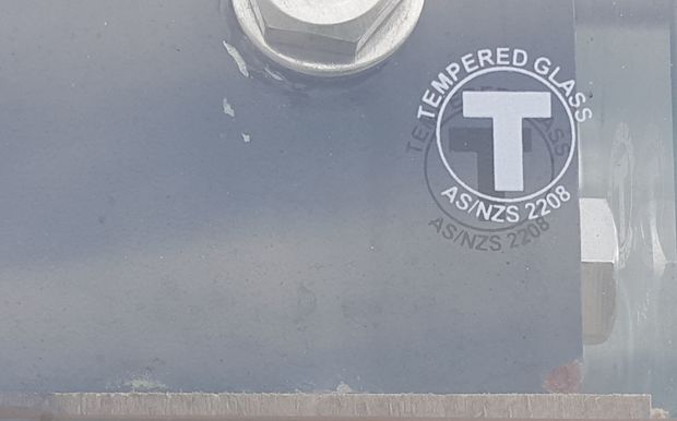 A non-compliant glass stamp sticker.